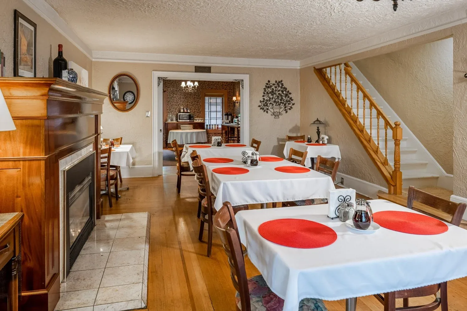The inn’s breakfast room with red place settings